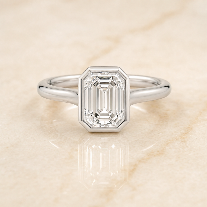 The Duran Simple Bezel Solitaire Emerald Cut Engagement Ring Setting in Platinum