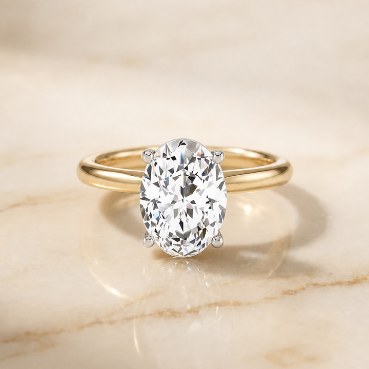 The Cyndi Curved Hidden Halo Solitaire Oval Engagement Ring Setting in 18K Yellow Gold