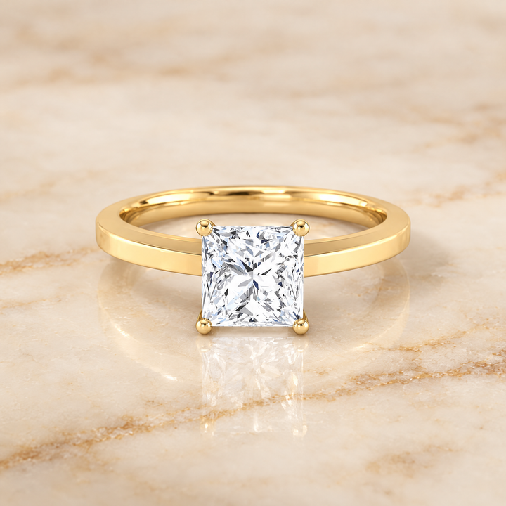 The Carmen Beveled Edge Comfort Fit Solitaire Princess Cut Engagement Ring Setting in 18K Yellow Gold