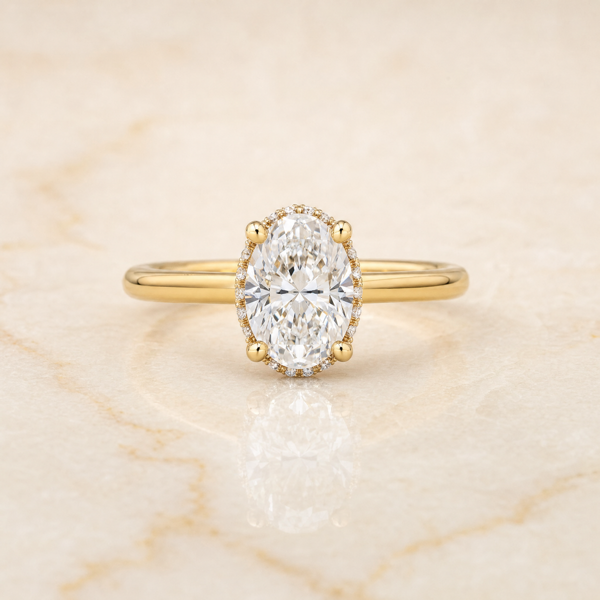 The Lana Secret Halo Adorned Prong Solitaire Oval Engagement Ring Setting in 18K Yellow Gold