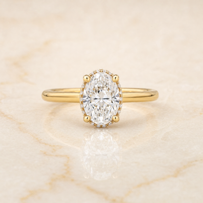 The Lana Secret Halo Adorned Prong Solitaire Oval Engagement Ring Setting in 18K Yellow Gold