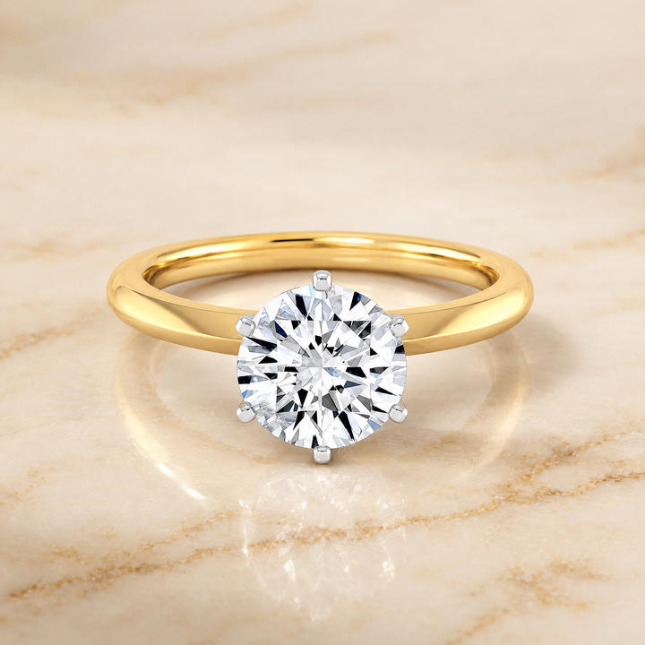 The Giovanna Pinched Comfort Fit Claw Prong Solitaire Round Engagement Ring Setting in 18K Yellow Gold