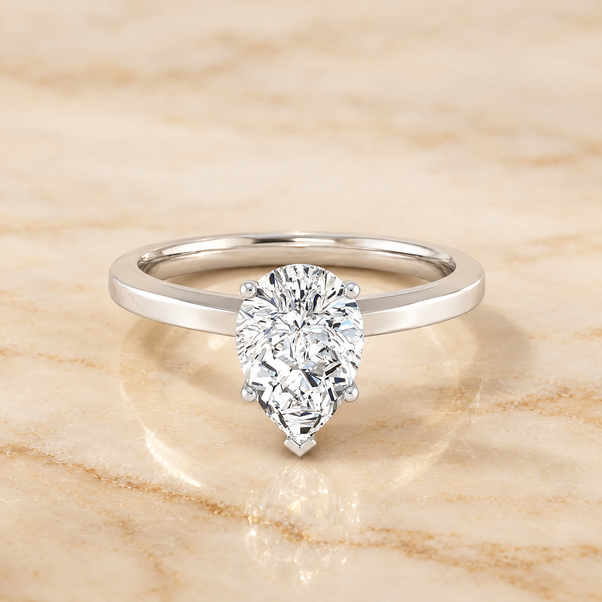 The Carmen Beveled Edge Comfort Fit Solitaire Pear Engagement Ring Setting in 18K White Gold