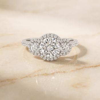 The Andrea Three Stone Halo Round Engagement Ring Setting in Platinum