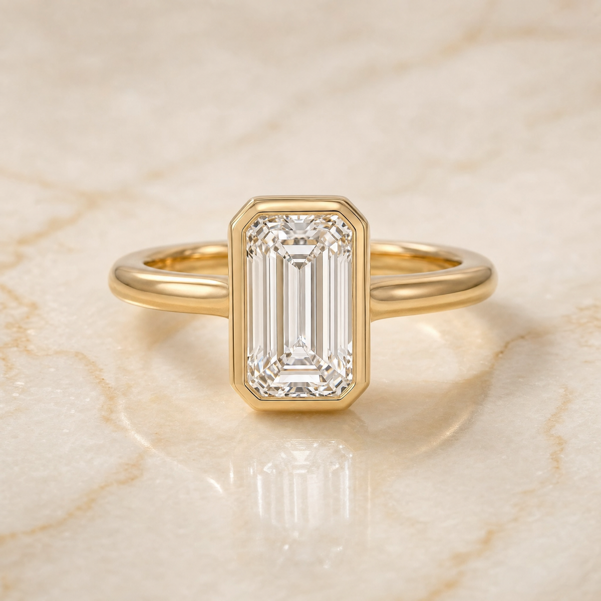 The Agnes Bezel Solitaire In Tapered Baguette Engagement Ring Setting in 18K Yellow Gold
