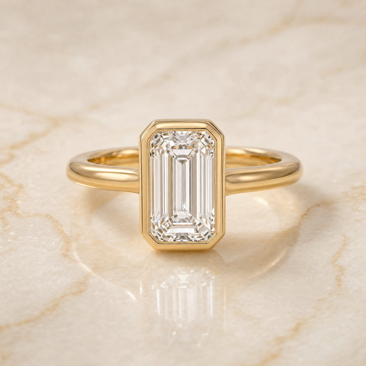 The Agnes Bezel Solitaire In Tapered Baguette Engagement Ring Setting in 18K Yellow Gold