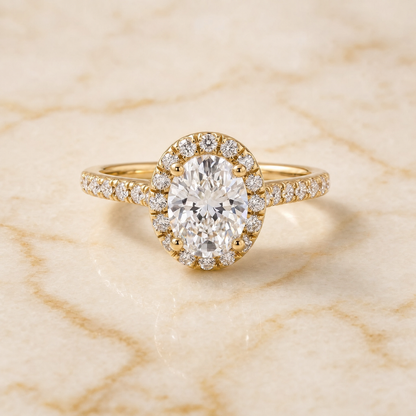 The Sade Classic French Pavé Halo Linear Oval Engagement Ring Setting in 18K Yellow Gold