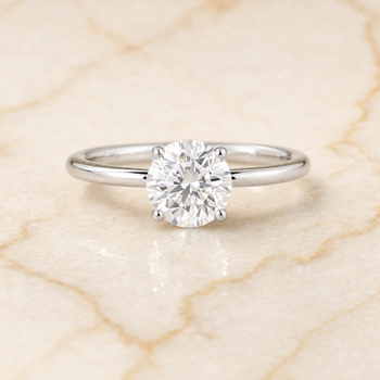 The Cyndi Curved Hidden Halo Solitaire Round Engagement Ring Setting in 18K White Gold