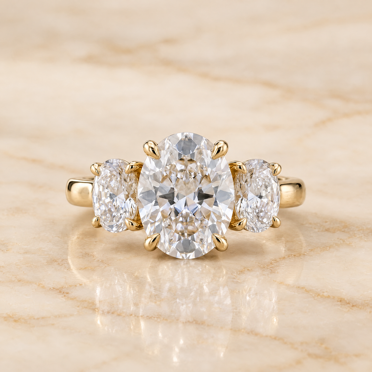 The Avery Channel Pavé Three Stone Round Engagement Ring Setting in 18K Yellow Gold