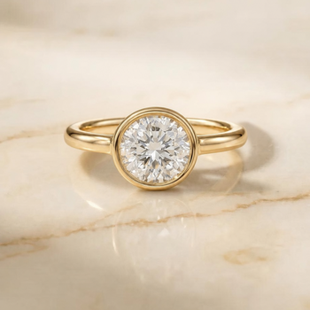 Agnes Round Brilliant Bezel Solitaire in 18K Yellow Gold