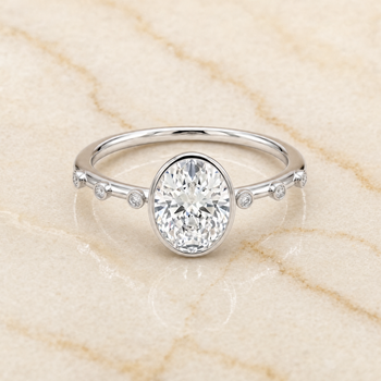 The Brandi Bezel Accent Solitaire Oval Engagement Ring Setting in Platinum