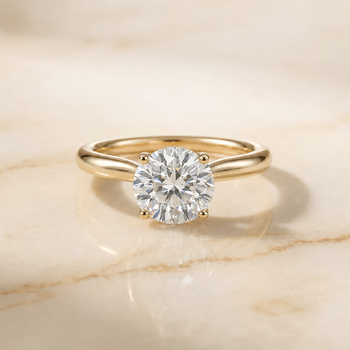 The Gladys Pinched Cathedral Solitaire Round Engagement Ring Setting in 18K Yellow Gold