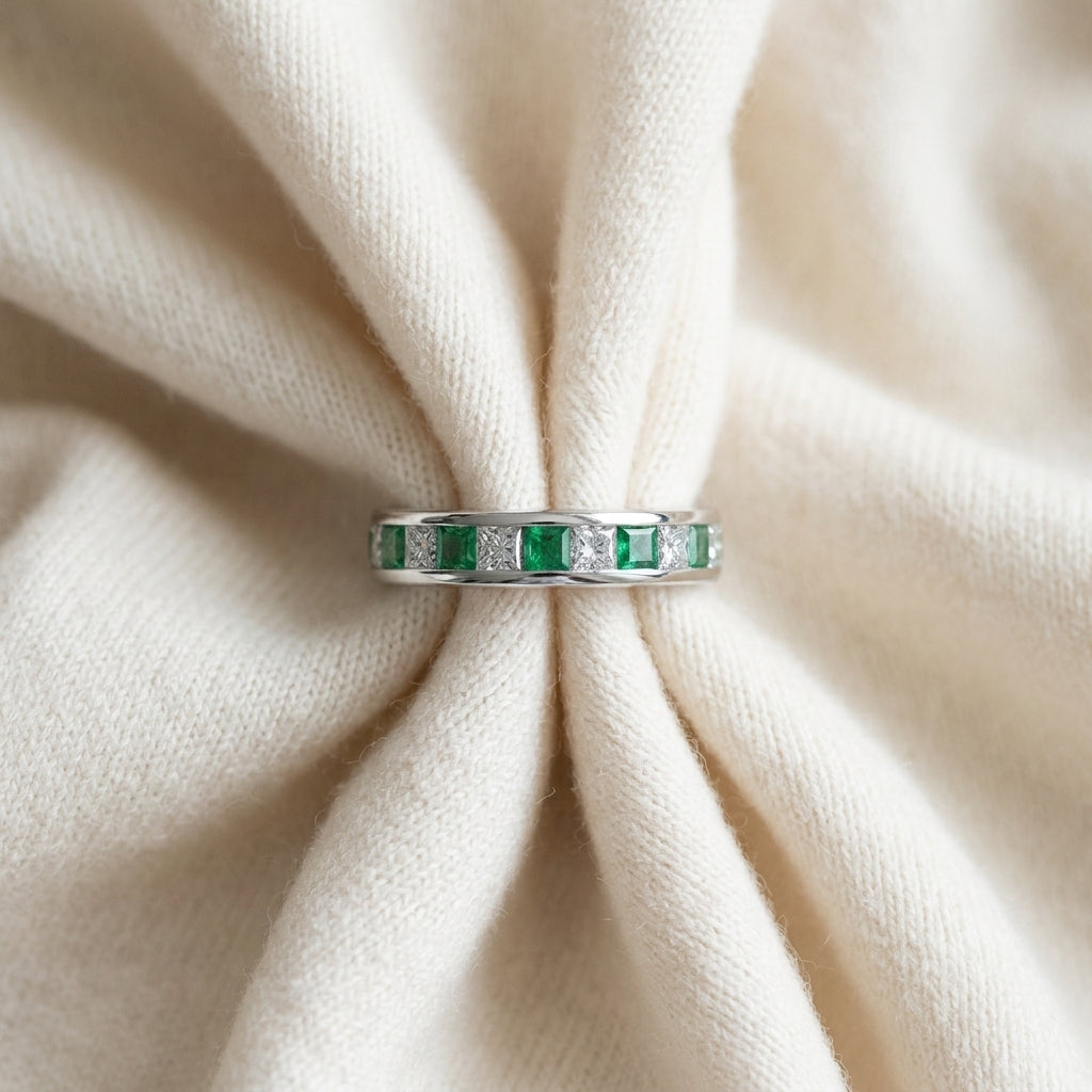 Emerald & Diamond Princess Cut Eternity Band in 18K White Gold - flat lay