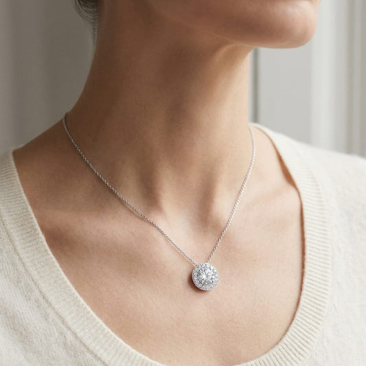 Natural Diamond Round Brilliant Halo Pendant in 18K White Gold, 0.7 ct. t.w., worn close-up portrait