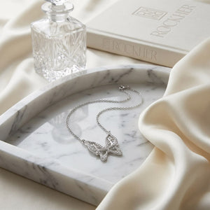 Diamond Floating Butterfly Necklace in 18K White Gold (0.10 Ct.tw), on marble vanity tray with silk