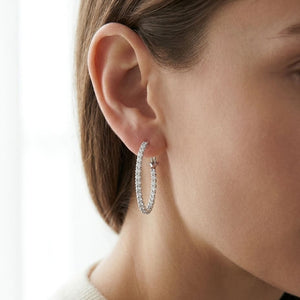 Diamond Hoop Earrings in 18K White Gold, worn close-up portrait