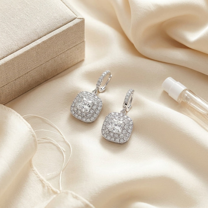Diamond Cushion Double Halo Dangle Earrings in 18K White Gold - flat lay