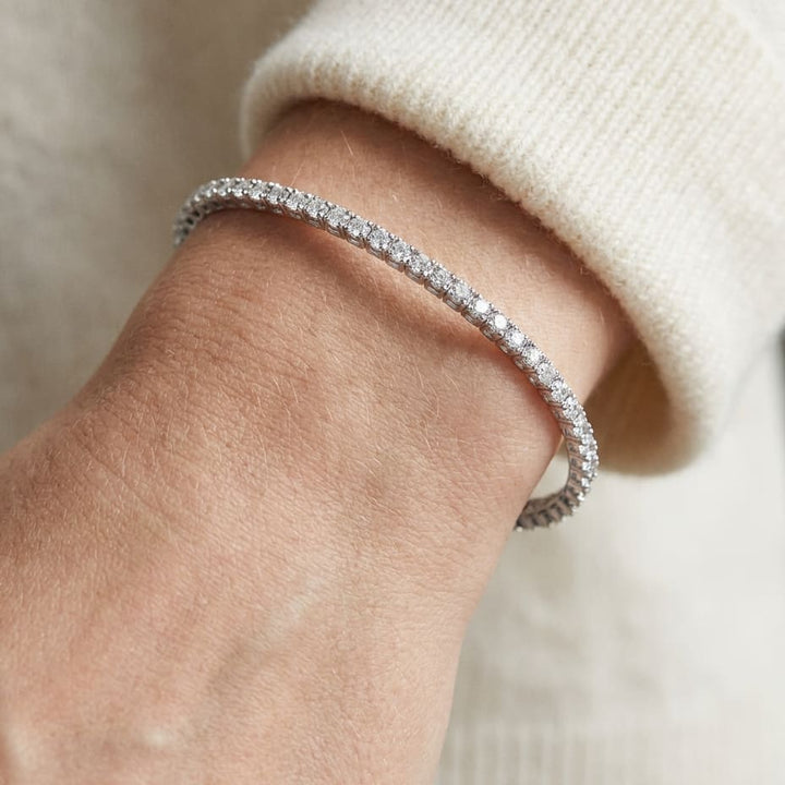 Diamond Open Cuff Bangle With Solid Heart Ends in 18K White Gold, worn close-up portrait