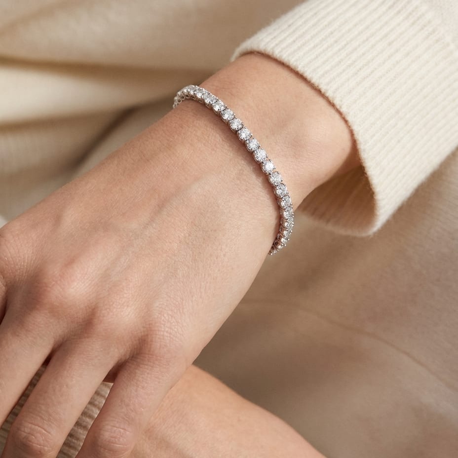 Diamond 4-prong Tennis Bracelet in 18K White Gold, worn close-up portrait