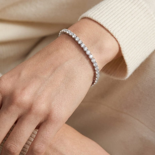 Diamond 4-prong Tennis Bracelet in 18K White Gold, worn close-up portrait