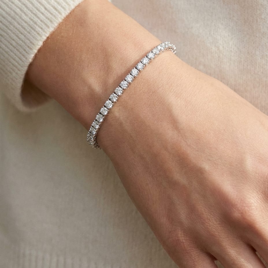 Diamond 4-prong Tennis Bracelet in 18K White Gold, worn close-up portrait