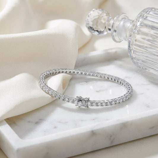 Diamond Bangle Bracelet in 18K White Gold, on marble vanity tray with silk