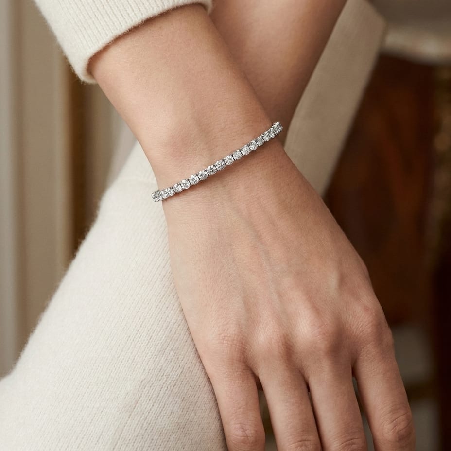 Diamond Bangle Bracelet in 18K White Gold, worn close-up portrait