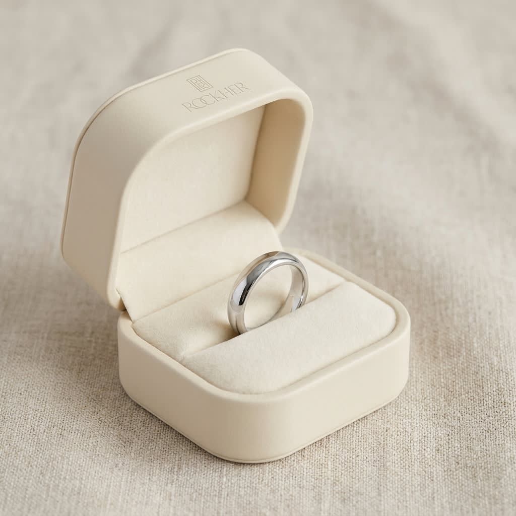 4mm Slightly Domed Traditional Oval Wedding Band in 18K White Gold, in navy velvet jewelry box