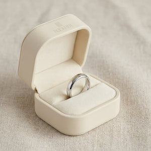 4mm Slightly Domed Traditional Oval Wedding Band in 18K White Gold, in navy velvet jewelry box