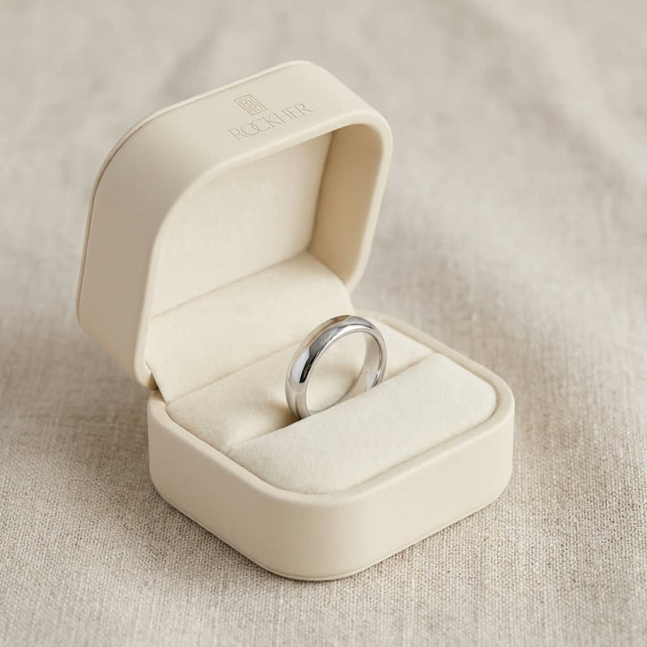 4mm Slightly Domed Traditional Oval Wedding Band in 18K White Gold, in navy velvet jewelry box