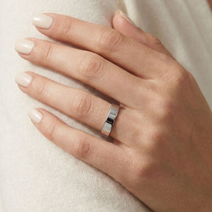 4mm Flat Comfort-Fit Wedding Band in 18K White Gold, worn on hand, close-up