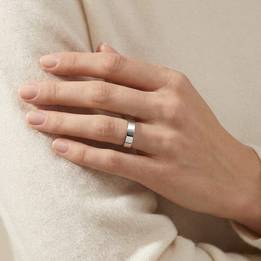 4mm Flat Comfort-Fit Wedding Band in 18K White Gold, worn on hand, full view