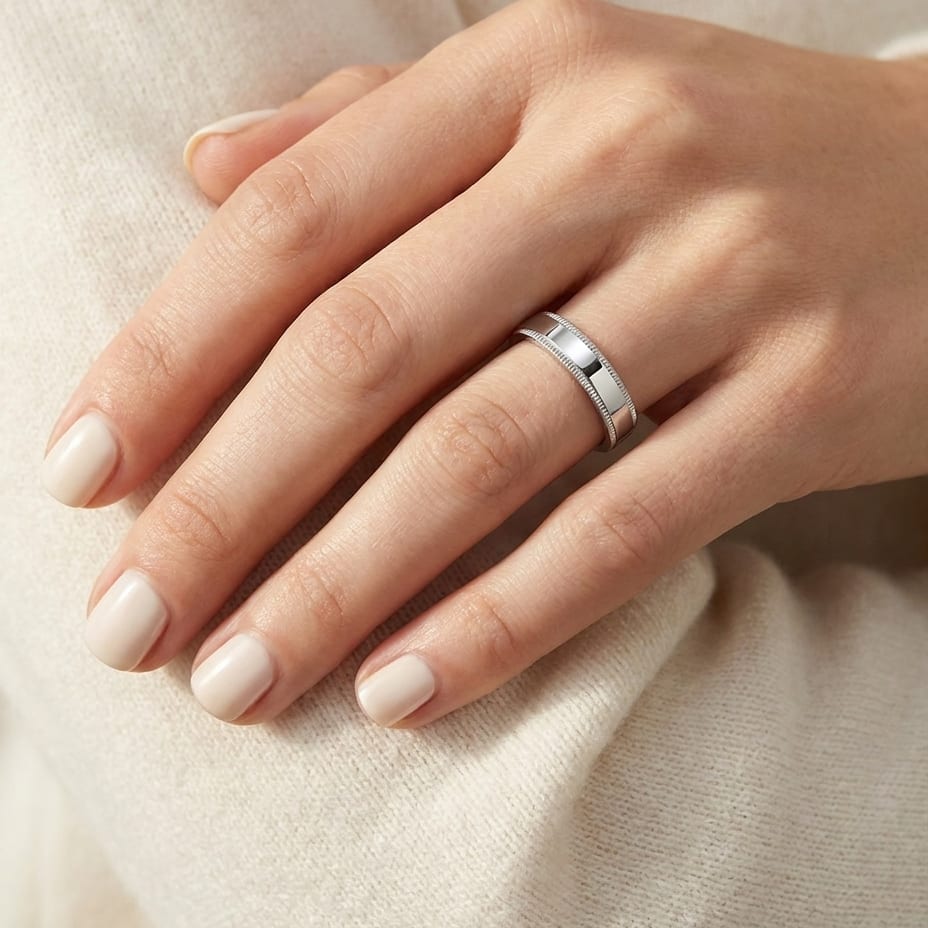 4mm Flat Milgrain Comfort-Fit Wedding Band in 18K White Gold, worn on hand, close-up