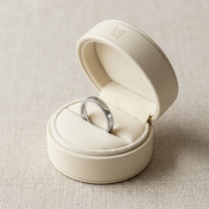 4mm Flat Milgrain Comfort-Fit Wedding Band in 18K White Gold, in navy velvet jewelry box