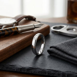 4.5mm Deluxe Comfort-Fit Wedding Band in 18K White Gold, on walnut surface with pocket square