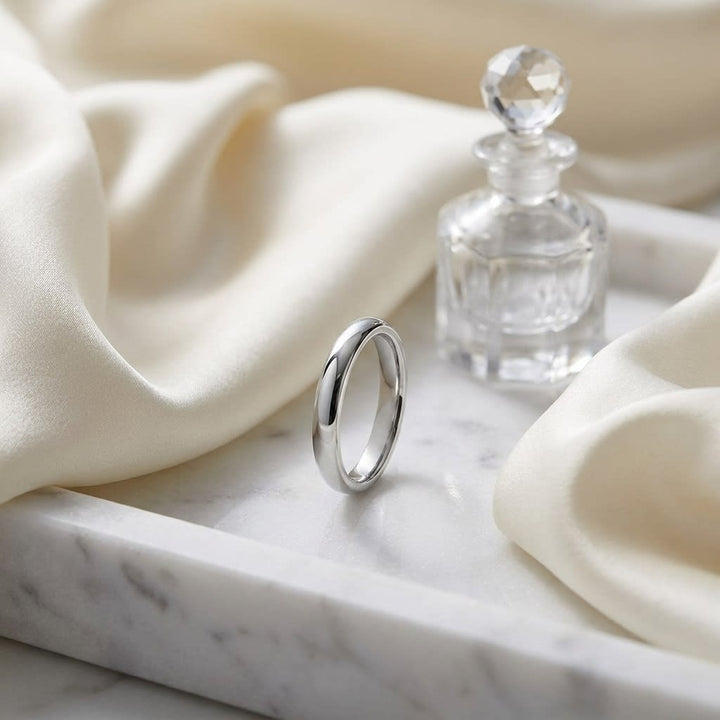 3mm High Dome Comfort-Fit Wedding Band in 18K White Gold, on marble vanity tray with silk