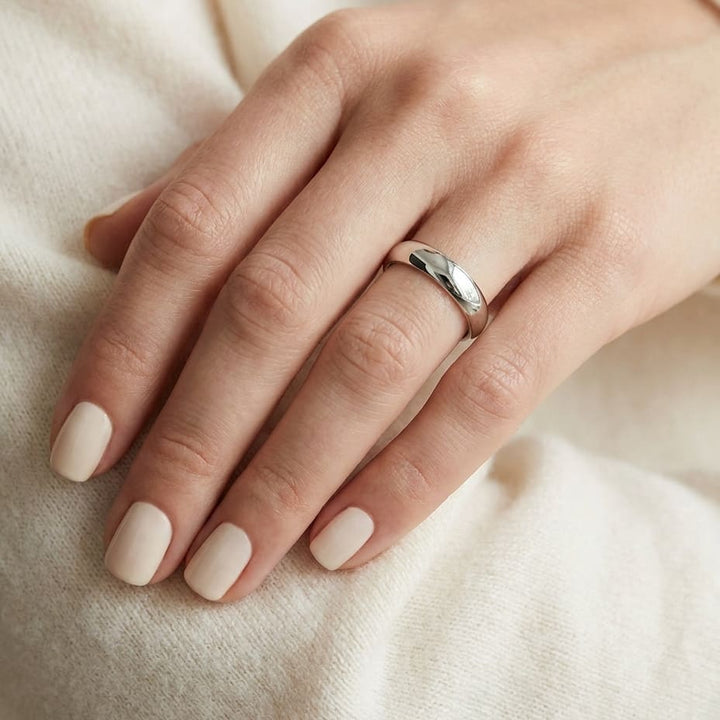 4mm High Dome Comfort-Fit Wedding Band in 18K White Gold, worn on hand, close-up