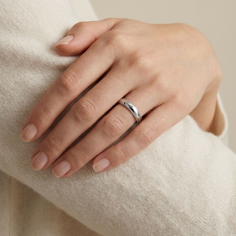 4mm Slightly Domed Milgrain Comfort-Fit Wedding Band in 18K White Gold, worn on hand, full view