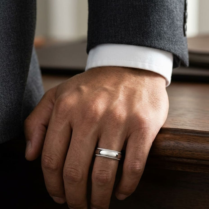 6mm Slightly Domed Double Milgrain Comfort-Fit Wedding Band in 18K White Gold, worn on hand, masculine full view