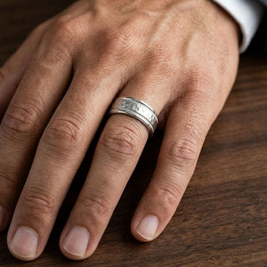 8mm Hammered Center High Polish Round Edge Carved Wedding Band in 18K White Gold, worn on hand, masculine close-up
