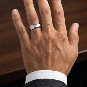 6mm Hammered Finish Carved Wedding Band in 18K White Gold, worn on hand, masculine close-up