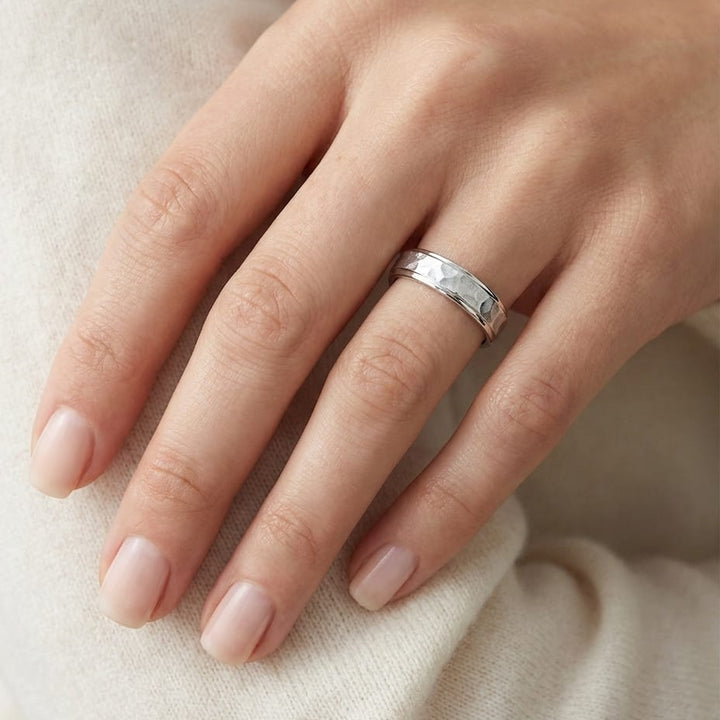 4mm Hammered Finish Carved Wedding Band in 18K White Gold, worn on hand, close-up