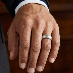 6mm High Polish Round Edge Carved Wedding Band in 18K White Gold, worn on hand, masculine close-up