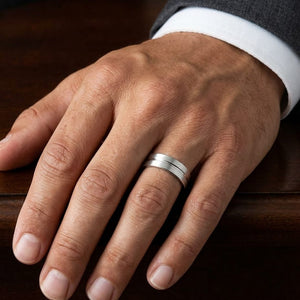 6mm Satin Finish High Polished Center Cut Carved Wedding Band in 18K White Gold, worn on hand, masculine close-up