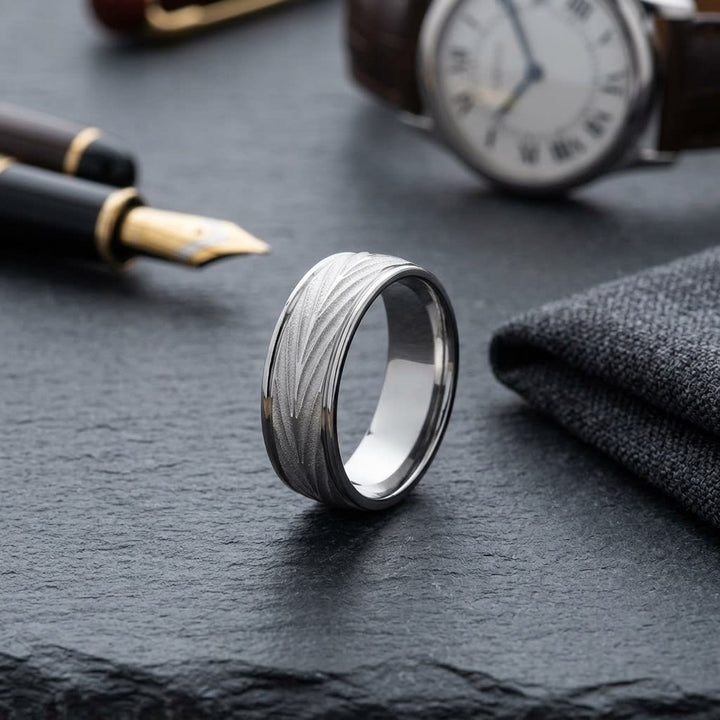 7mm Comfort-Fit Wedding Band in 18K White Gold, on walnut surface with pocket square