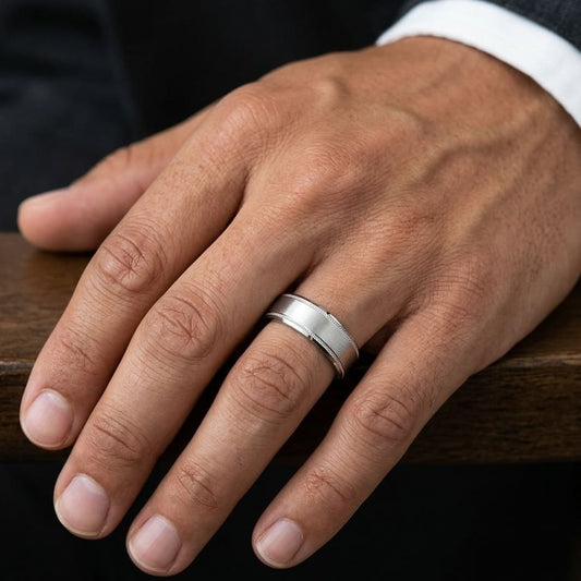 8mm Satin Finish Carved Wedding Band in 18K White Gold, worn on hand, masculine close-up