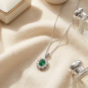 Emerald Oval & Diamond Pendant in 18K Gold in 18K White Gold - flat lay