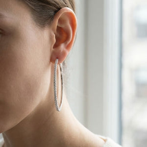 Diamond Hoop Earrings in 18K Yellow Gold, worn close-up portrait