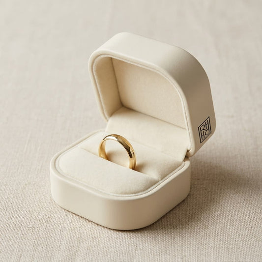 2mm Slightly Domed Traditional Oval Wedding Band in 18K Yellow Gold, in navy velvet jewelry box