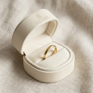 3mm Slightly Domed Traditional Oval Wedding Band in 18K Yellow Gold, in navy velvet jewelry box